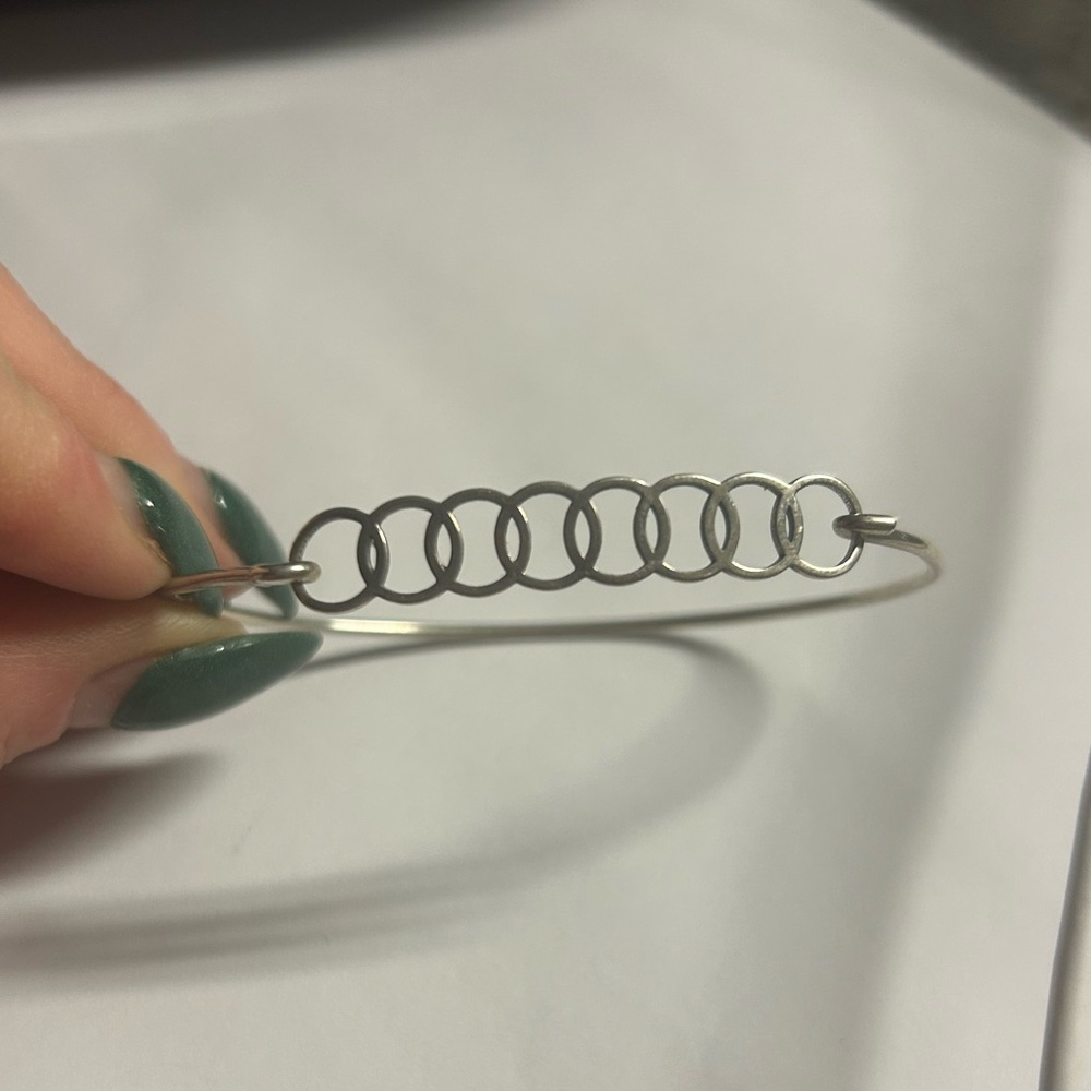 Chamilia sterling silver bangle featuring 7 interlocking circles
